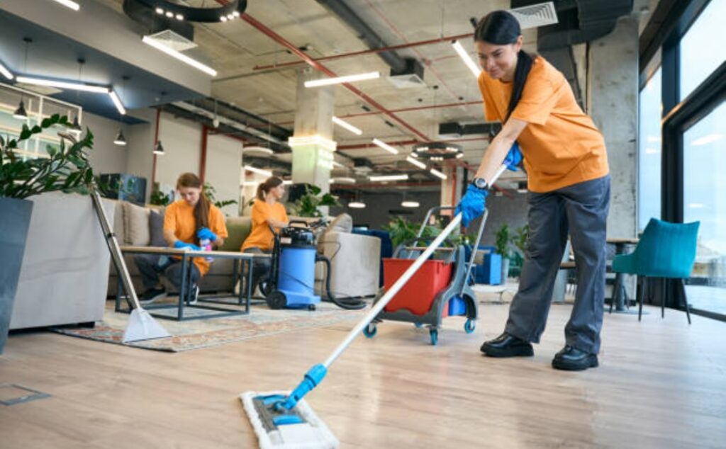 commercial cleaning employees in company uniforms”