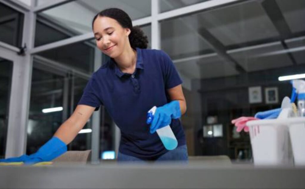 Office hygiene maintenance by a professional cleaning lady