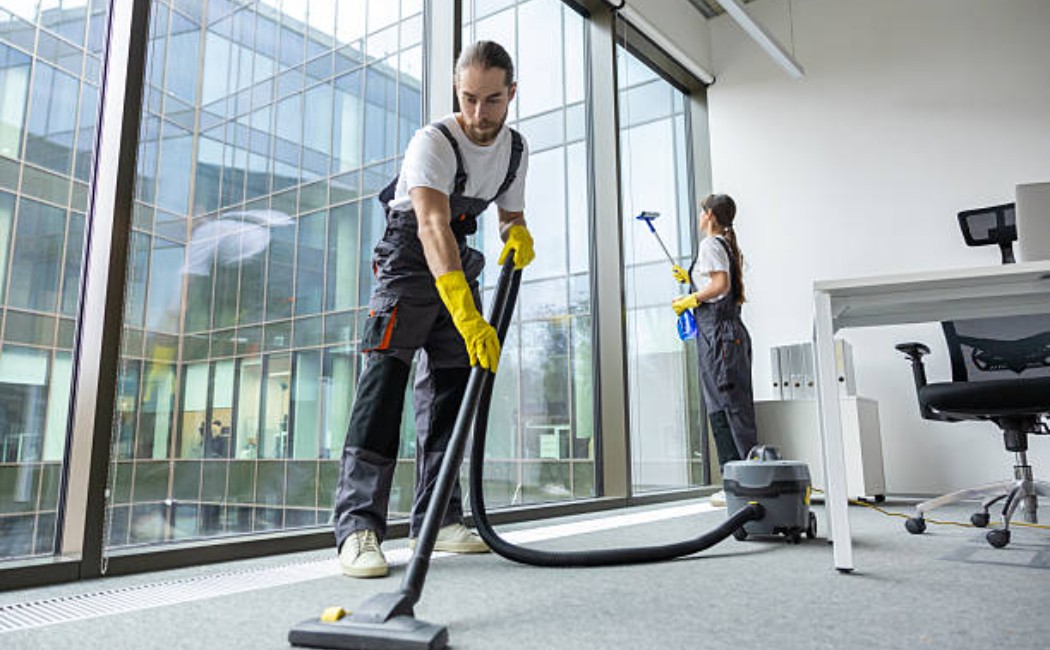 Professional office cleaning team at work, ensuring a spotless workspace