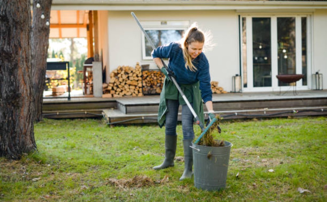 A Woman Cleaning in a green garden
