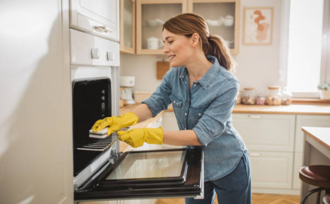 Residential cleaning service staff cleaning kitchen area