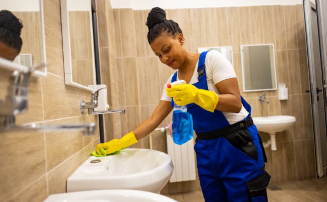 Deep bathroom cleaning in progress with brush and spray cleaner