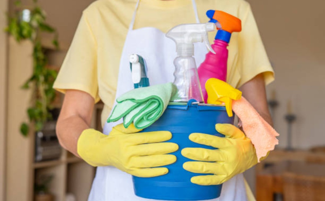 Residential cleaning professional prepping cleaning equipment
